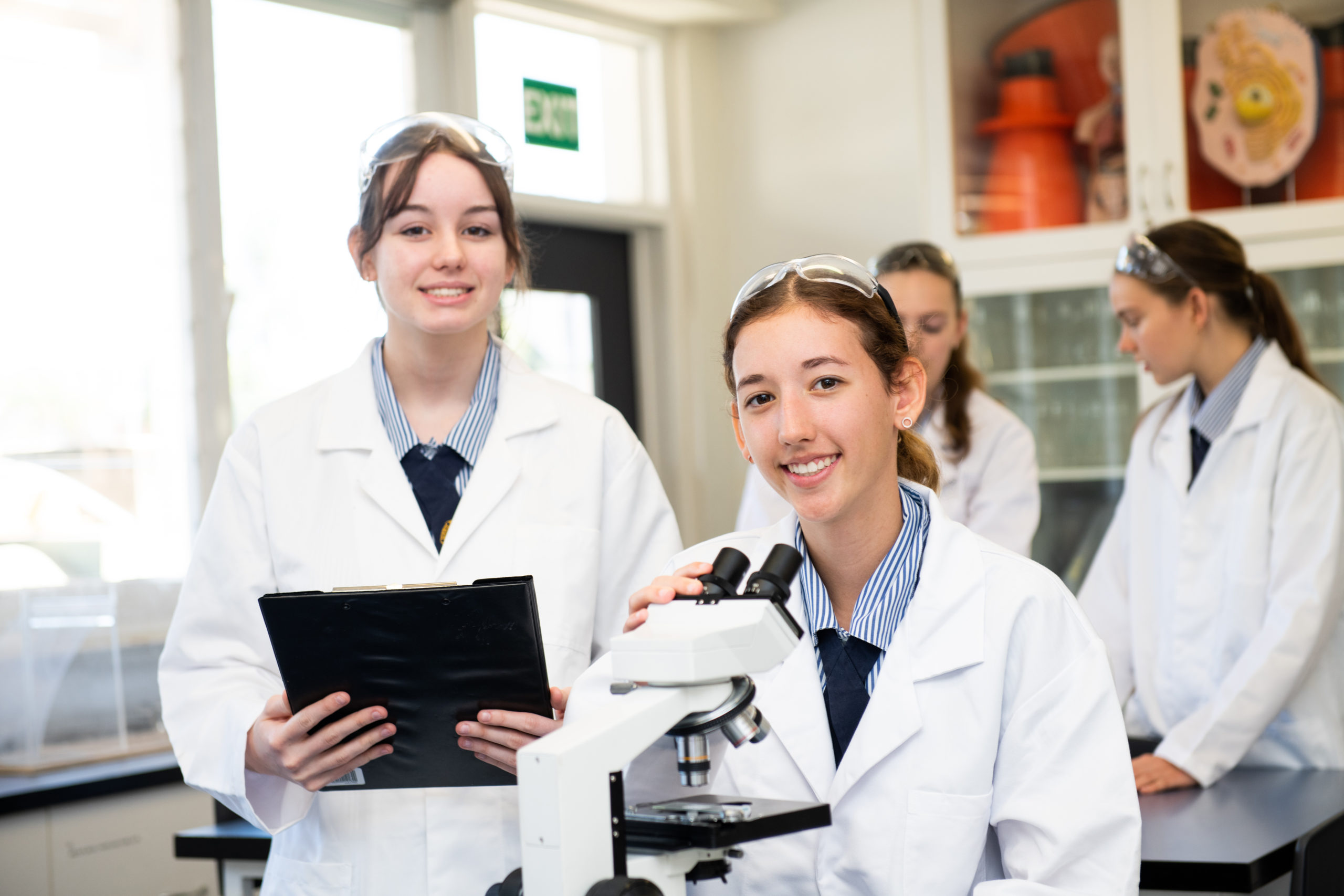 Students from St Patrick's College observing an experiment in the Science Lab.