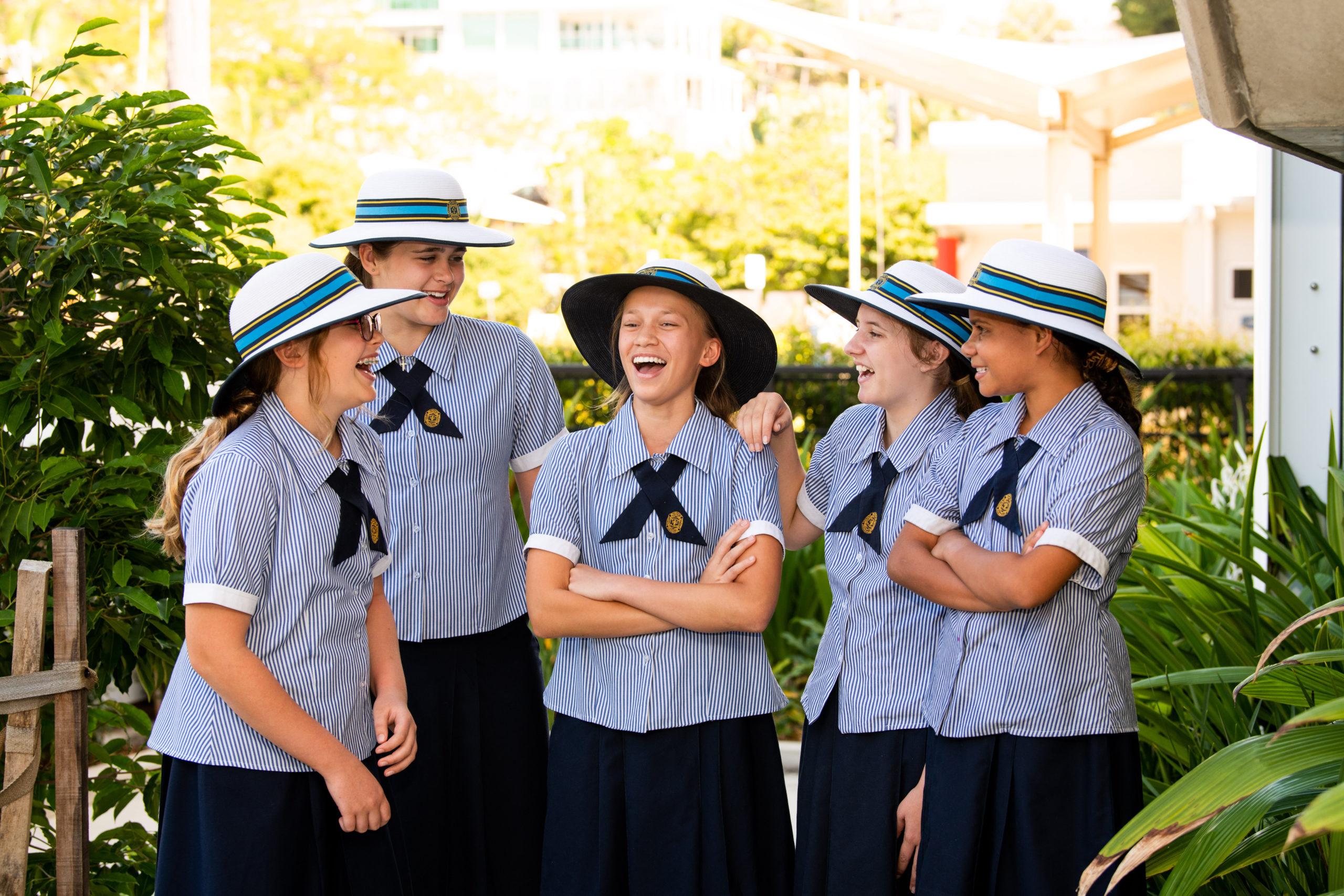 Students of St Patrick's College standing outside in nature. They are laughing and enjoying each other's company.