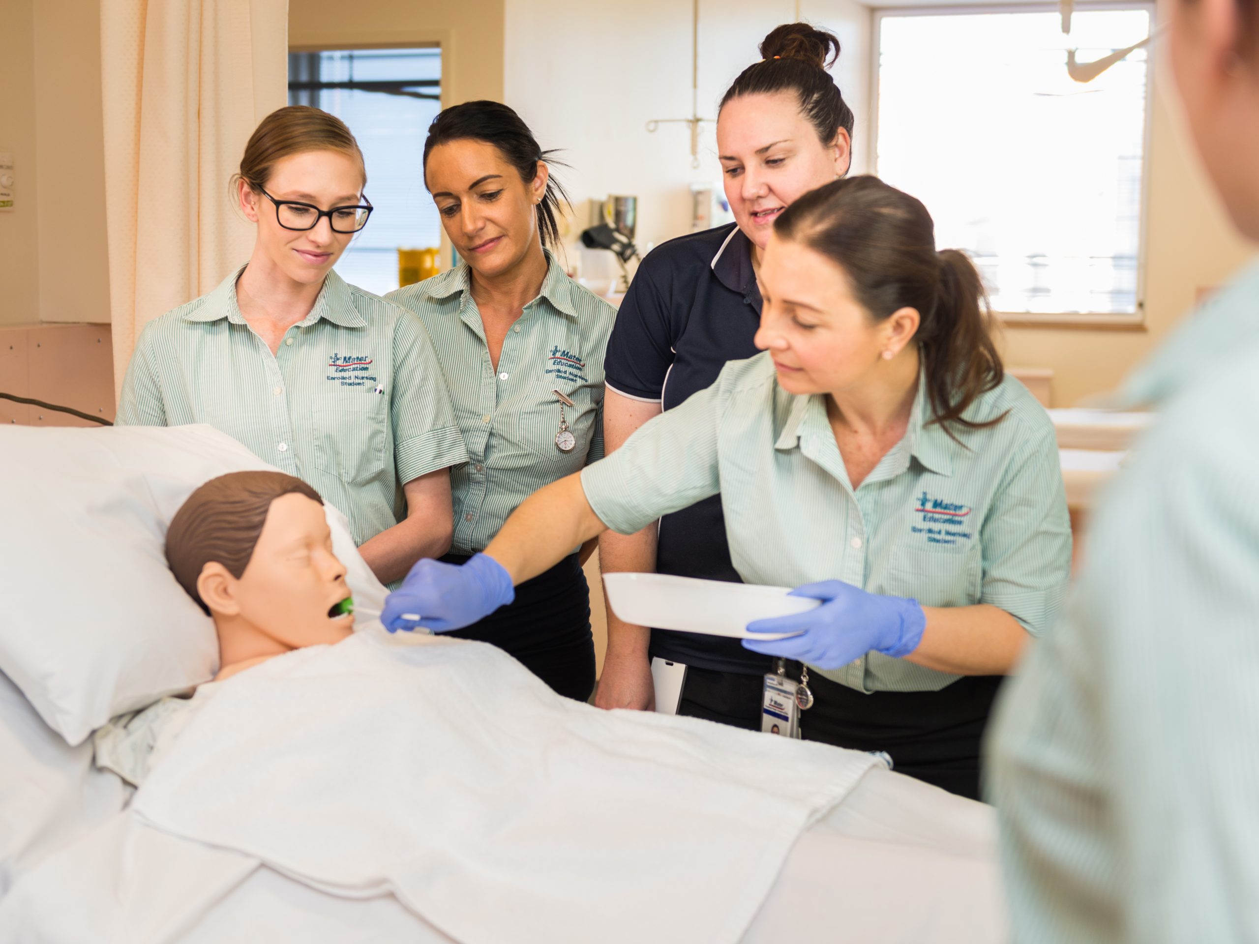 A group of medical students in a training ward.