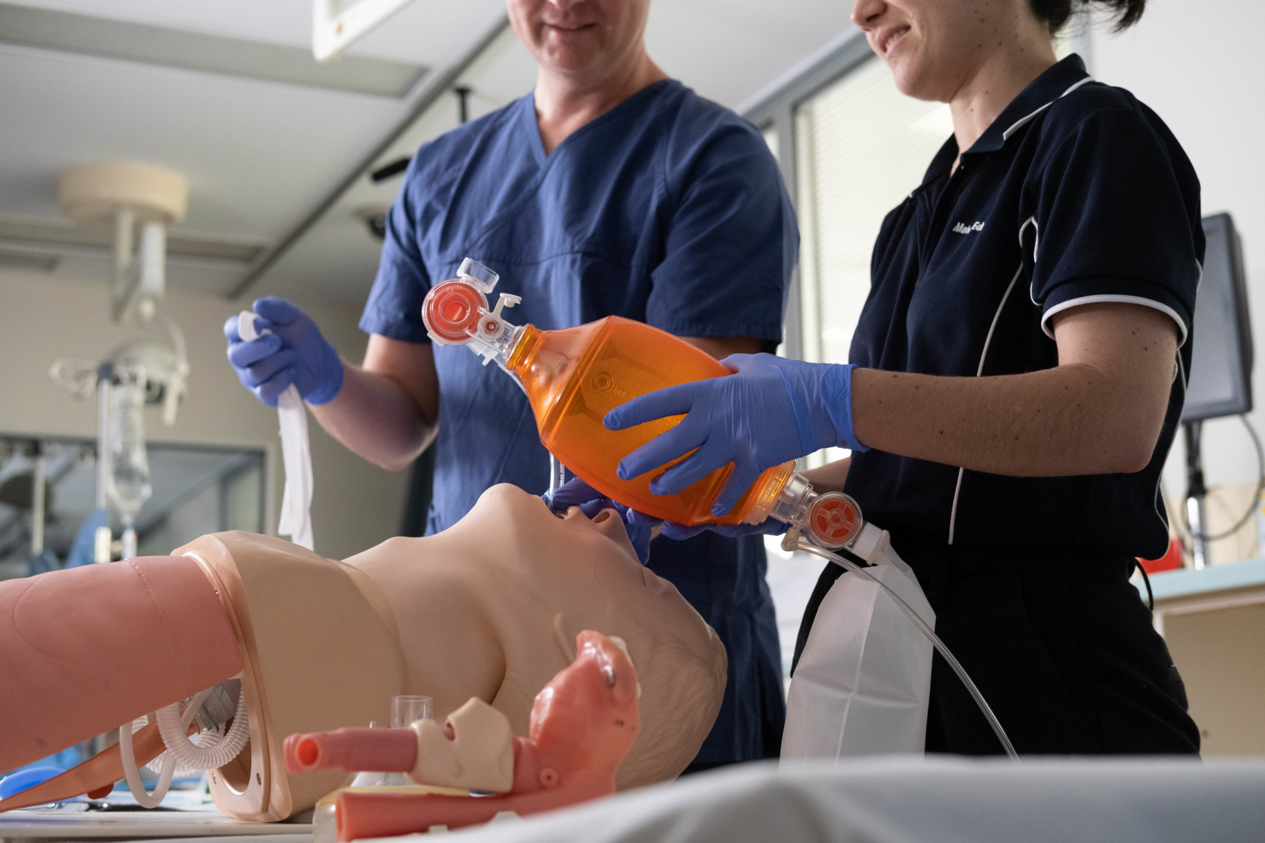 Medical students in a training ward learning about ventilator support.