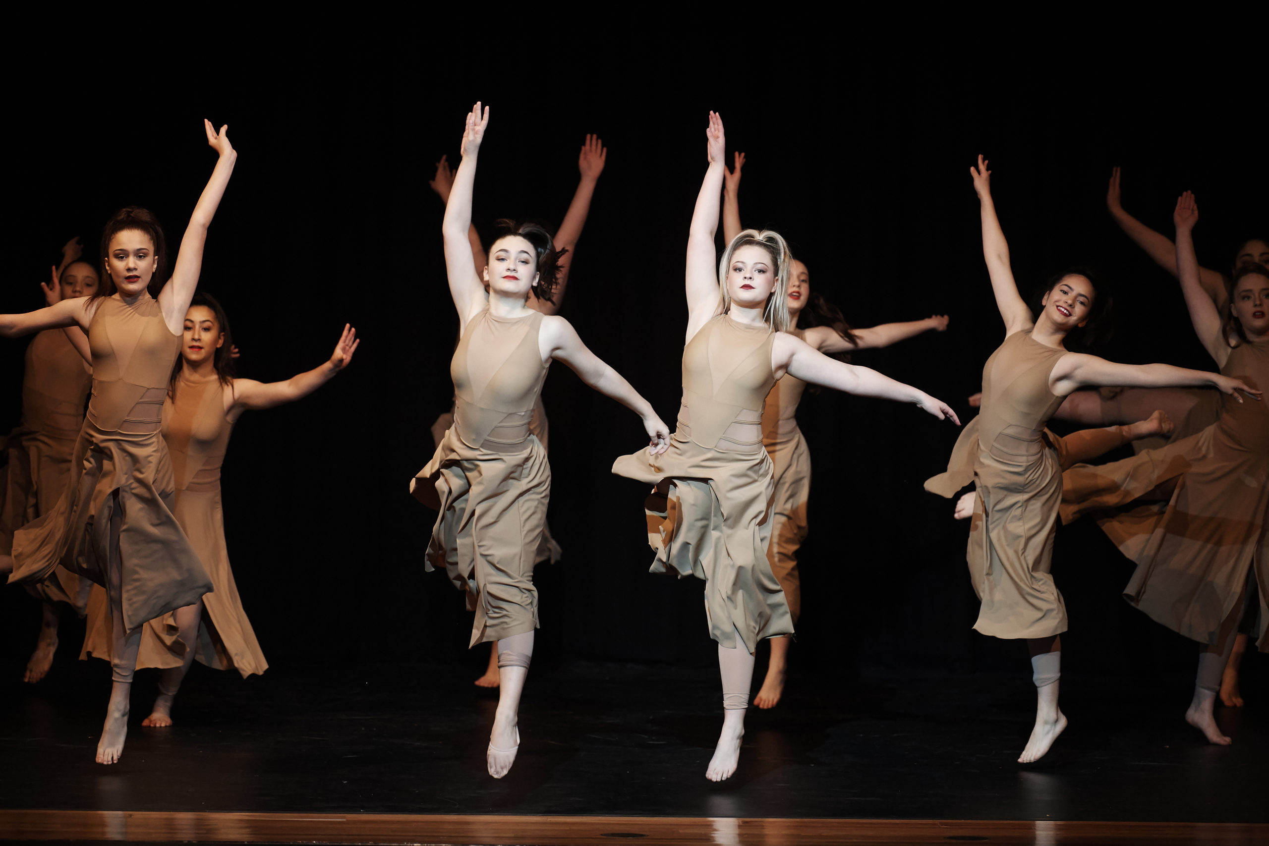 This is a photo of a group of students from Our Lady of Mercy College Parramatta dancing in unison.