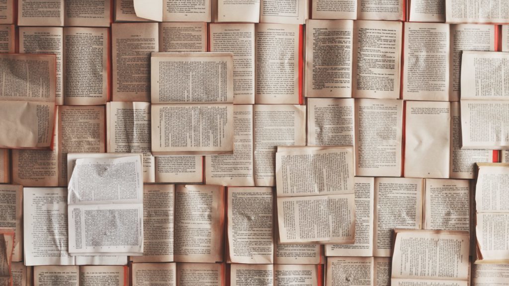 A creative photograph of open books laid out to form a grid.
