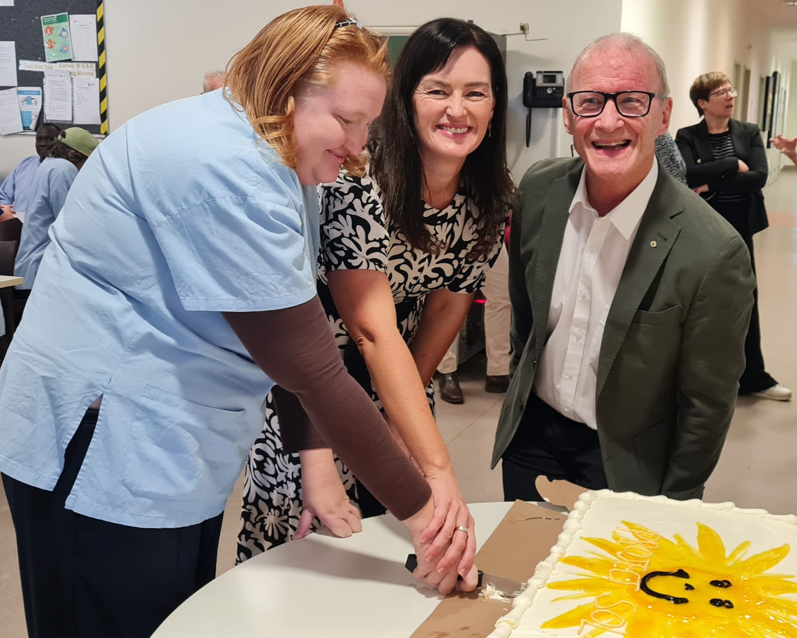 Celebrating the new solar panels with cake.
