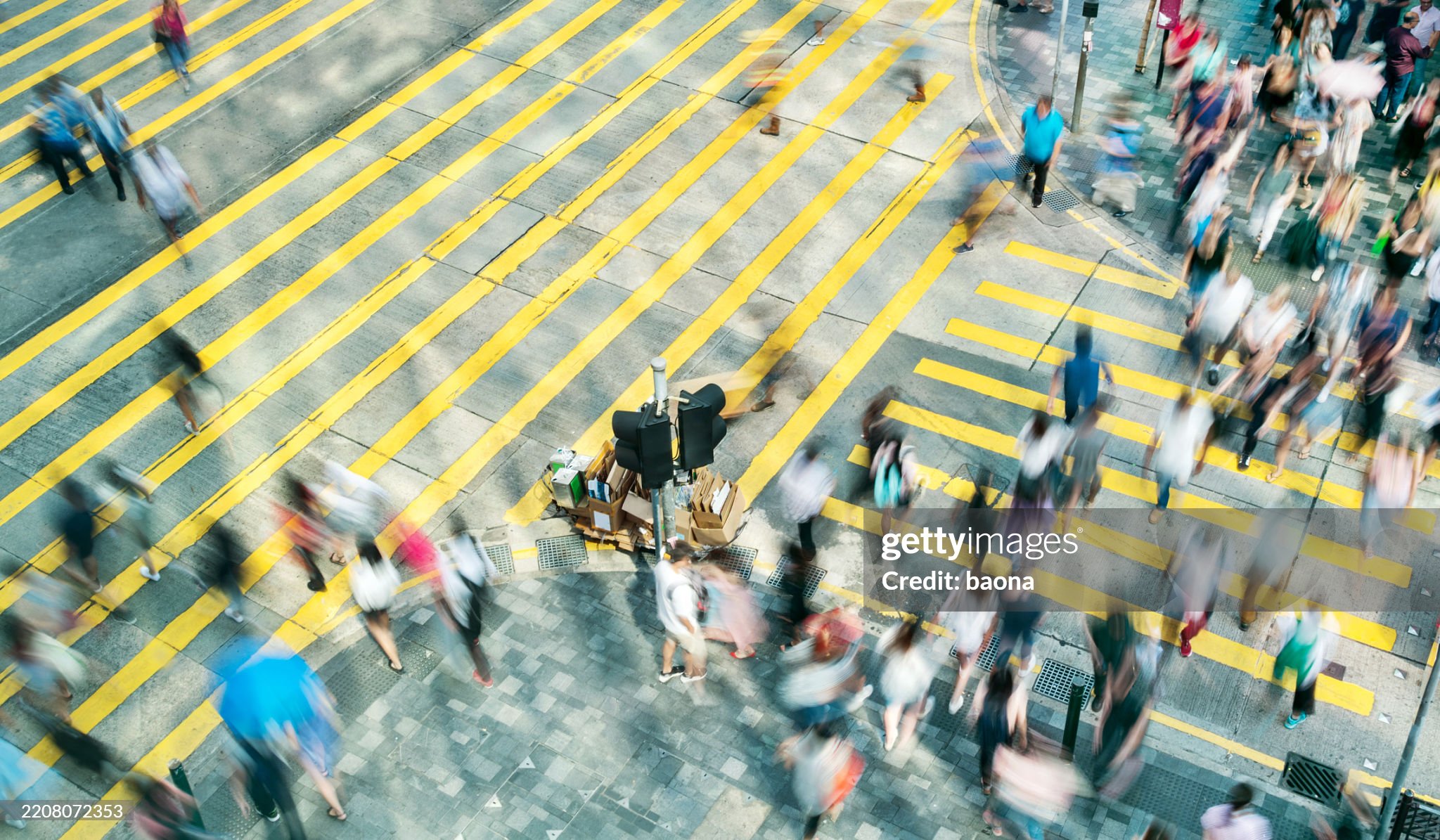 Aerial view of rush hour in city crosswalk.
